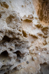 sand wall blurred by rain
