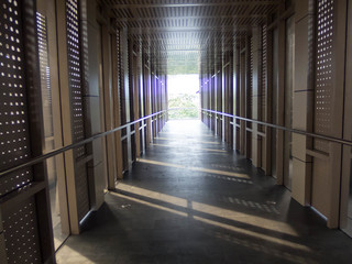 The corridor connects the building with light.