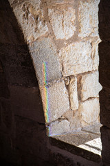 rainbow on the stone wall of the fortress