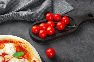 Fresh margarita pizza with tomatoes, basil, mozzarella cheese