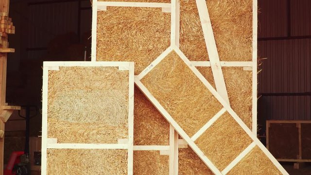 Straw panels frame construction in manufactory.