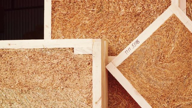 Straw panels frame construction in manufactory.