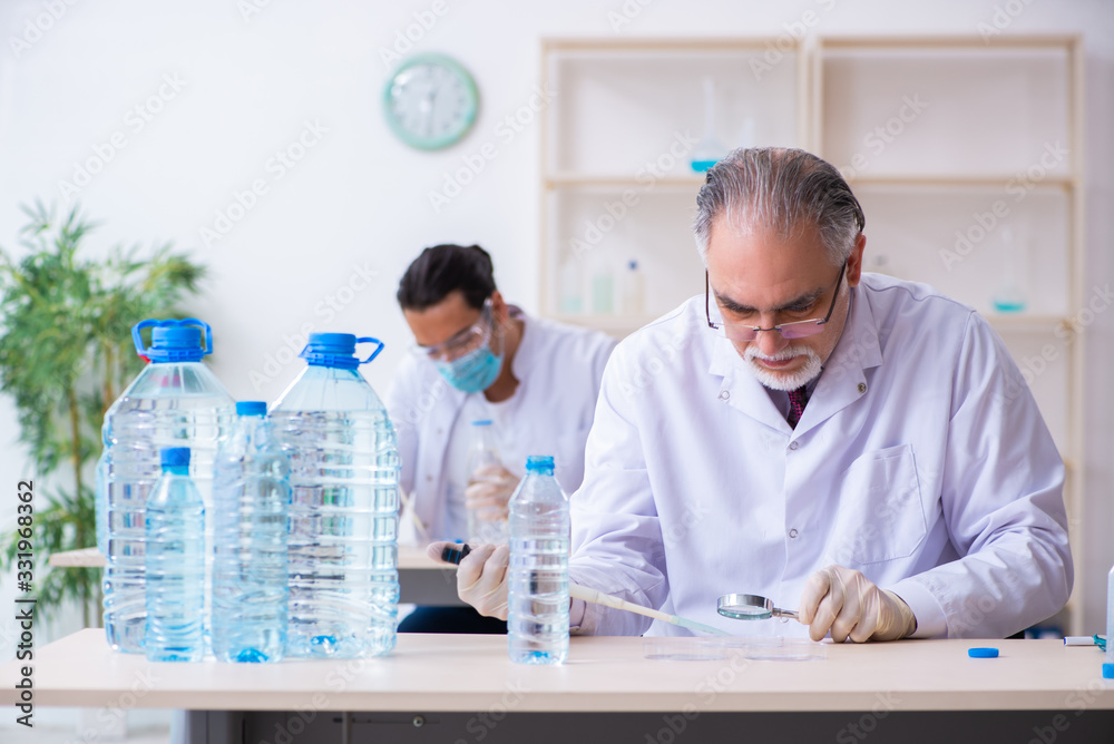 Wall mural two chemists working in the lab