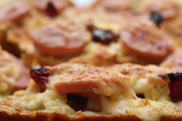 Croutons with cheese, sausage and sun-dried tomatoes