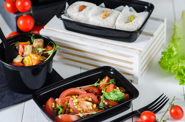 Healthy food and diet concept, restaurant dish delivery. Take away of fitness meal. Weight loss nutrition in boxes. Three meals a day - salad, dessert and meat with vegetables
