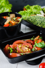 Healthy food and diet concept, restaurant dish delivery. Take away of fitness meal. Weight loss nutrition in boxes. Three meals a day - salad, dessert and meat with vegetables
