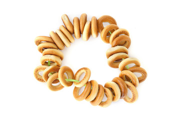 Small bagels or baranki  isolated on white background. Bunch of sushki dry bread rolls..