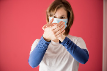 nurse with surgical mask shows how to properly wash your hands with gel or soap to prevent coronavirus infections and avoid the spread of the world pandemic started in china