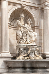 Fototapeta na wymiar Neptune fountain at the entrance of Albertina museum, Vienna, Austria