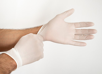 Putting on disposable gloves