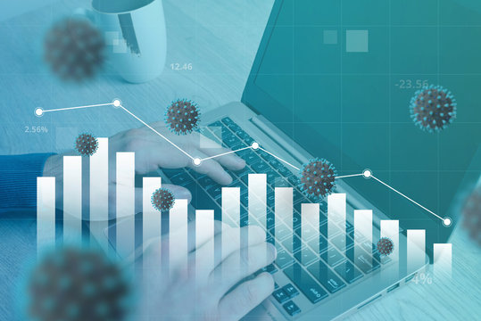 Coronavirus Affects The Decline Of The World Economy. Concept Of Working And Analyzing Data On A Computer. Stock Graph Fall