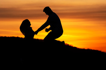 Lovers couple in sunset time in nature ( shilouette )