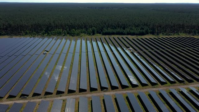 Drone footage close up of solar power station build on former airport field in Templin, Germany
