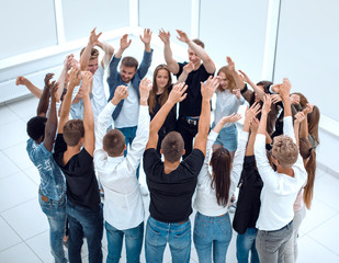 group of casual young people standing in a circle