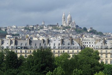Fototapeta na wymiar Panorama view of the famous Montmartre borough in the 18th arrondissement with the Basilica of the Sacre Coeur; France, Europe