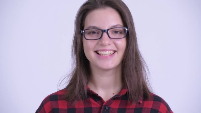 Face of happy young beautiful hipster woman nodding head yes