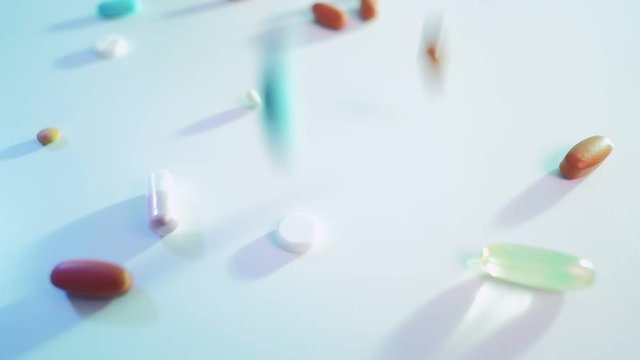 Coronavirus outbreak. Medication overdose. Pills capsules scattering on white surface.