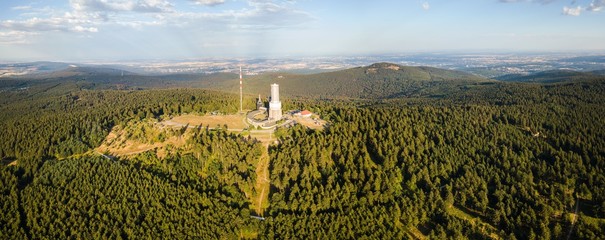 Panoramic view on the summit of the mountain Feldberg, the highest elevation of the Taunus mountains in Germany druing summer aerial/drone