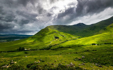 Fototapeta na wymiar Scottish Highlands summer landscape in Glen Strae. Green valley with dramatic storm clouds near Dalmally, Scotland.