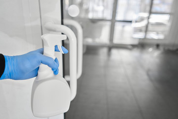 Disinfection, cleaning and washing of door handles. COVID-19. Prevention of coronavirus infection....