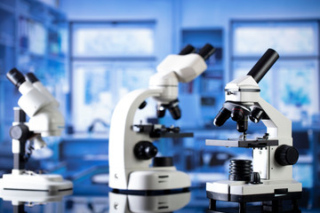 Modern scientific laboratory interior. Reaserch station with microscopes on the glass table.