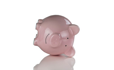 Tipped over piggy bank for financial crisis concept