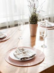  Empty plate and silverware set on wooden table