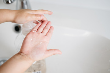 boy washing his hands after playing to fight the coronavirus. Close up of hands