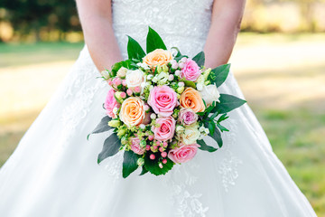 bride holds a beautiful wedding bouquet