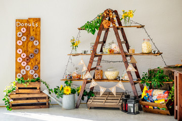 Candy Bar and salty bar with donuts and autumn thanks giving decoration at wedding
