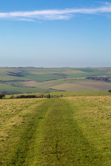 Fototapeta na wymiar A pathway in the South Downs with a view of an idyllic Sussex landscape