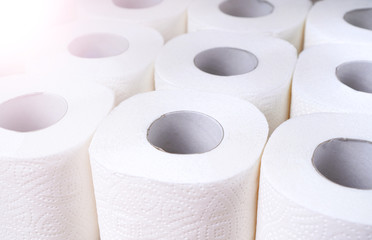 Toilet paper supplies background. Wc paper rolls top view. Goods required for quarantine..