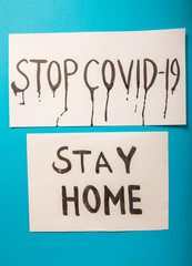 Coronavirus STOP. Stay at home. covid-19  sign on blue  background. To stop the virus.