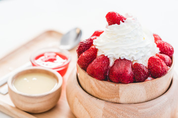 sweet desserts, strawberry with cream on ice and honey