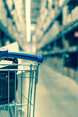 Retro shopping cart in supermarket