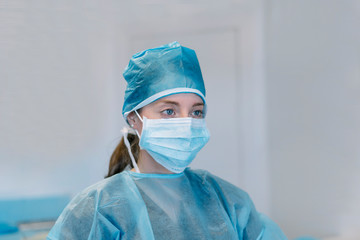 female doctor with mask protecting contagious diseases virus