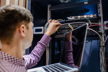 In the server room a technician