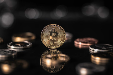Bitcoin is the leader of cryptocurrency. Coin on black background.