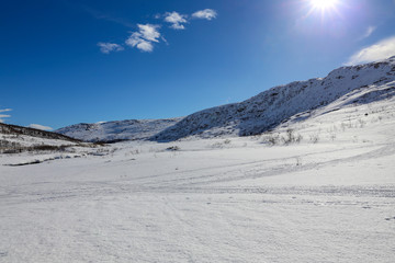 Winter and sun with great ski conditions on the Tosen mountain in Grane municipality, Northern Norway