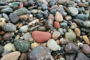 Pebble stones on the beach for background or banner