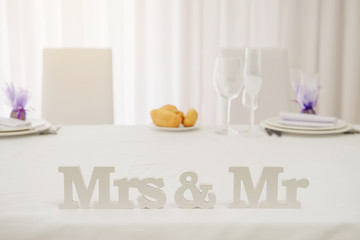 White wood letter on the table Mr Mrs
