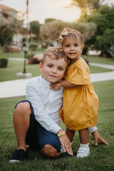 Fototapeta premium Two kids, brother and sister hugging