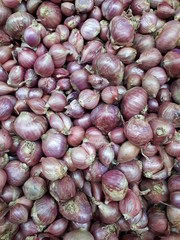 A collection of shallots sold in the market in the morning.