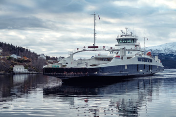 Fototapeta na wymiar Ferry aproaching pier in Norway
