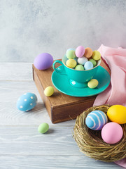 Easter holiday decorations with chocolate eggs and easter eggs decor on wooden table