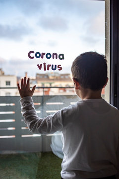 Little Boy In Confinement For The Coronavirus Pandemic