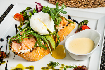 sandwich with salted salmon and poached egg