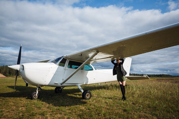 Young girl with small white aircraft