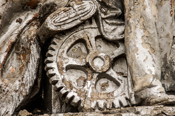 Fototapeta na wymiar abandoned old big gears industrial bas-relief on monument in Moscow