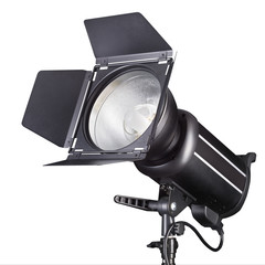 Photography studio flash isolated on white background with lamp.